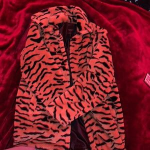 Faux fur Tiger striped. Black silk lining. Size small. Brand name is angle kiss.